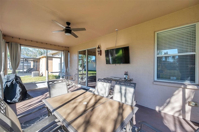 exterior space with ceiling fan and a storage shed