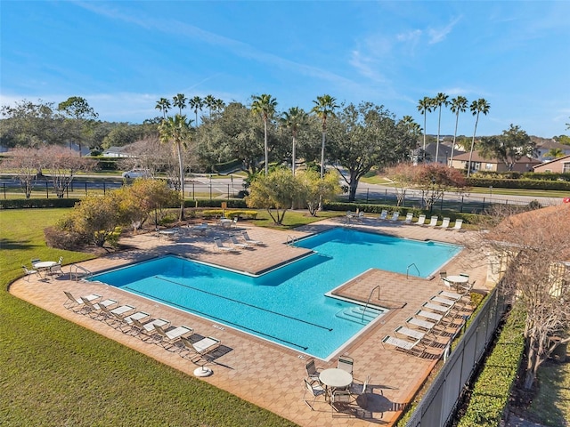 view of pool featuring a yard and a patio