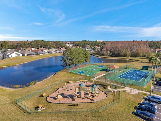 birds eye view of property with a water view