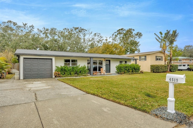 ranch-style house with a garage and a front lawn