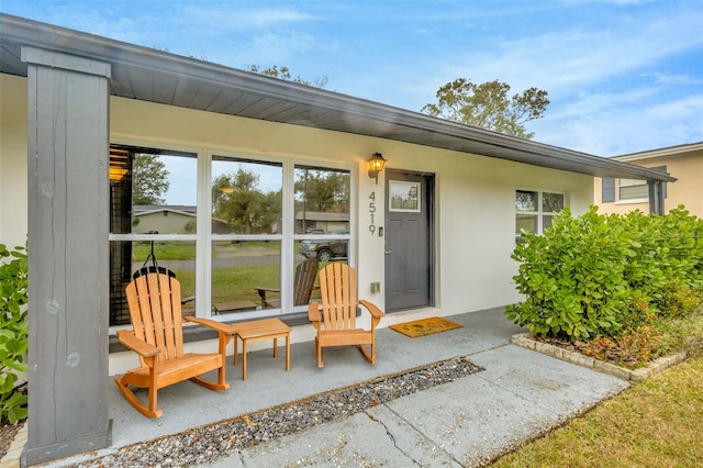 property entrance with a patio area