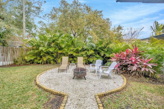 view of yard featuring an outdoor fire pit