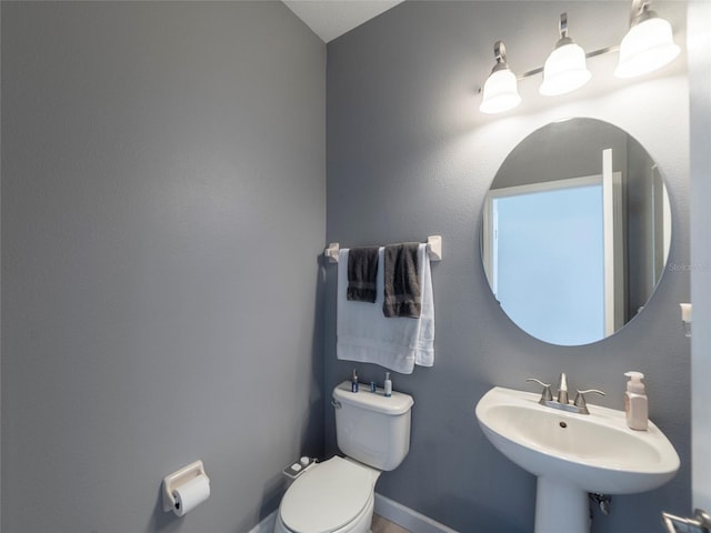 bathroom with sink and toilet