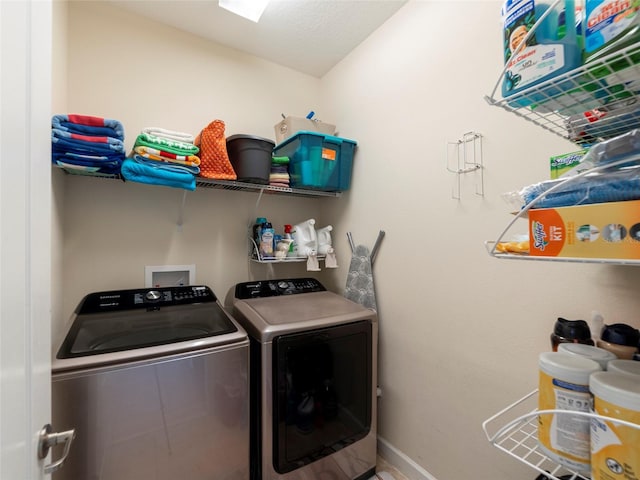 laundry room featuring washing machine and dryer