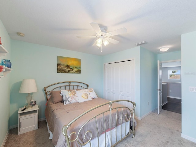 carpeted bedroom with a closet and ceiling fan