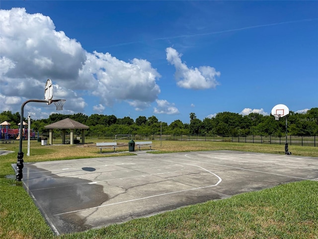 view of sport court with a gazebo and a yard