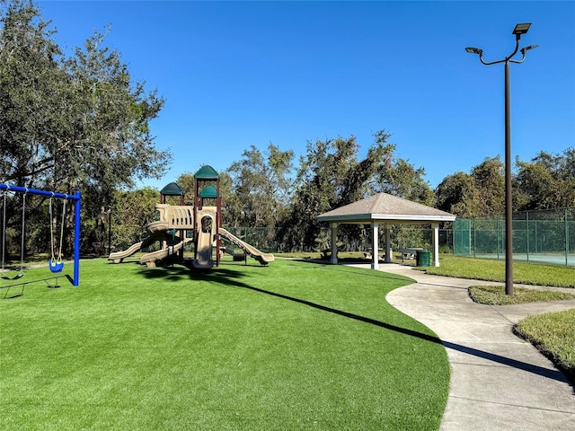 view of jungle gym featuring a gazebo and a lawn