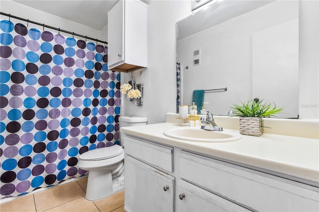 1400 Gandy Blvd N Unit 506, Saint Petersburg, FL 33702 - bathroom with vanity, toilet, and tile patterned flooring