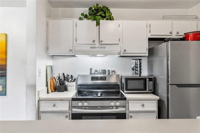 1400 Gandy Blvd N Unit 506, Saint Petersburg, FL 33702 - kitchen featuring white cabinetry and appliances with stainless steel finishes