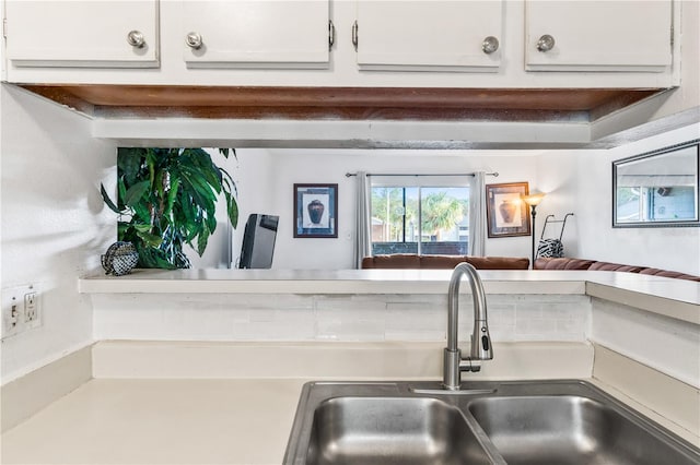 1400 Gandy Blvd N Unit 506, Saint Petersburg, FL 33702 - kitchen featuring sink and white cabinets