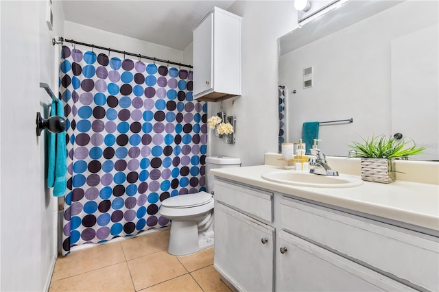 1400 Gandy Blvd N Unit 506, Saint Petersburg, FL 33702 - bathroom with vanity, tile patterned floors, and toilet