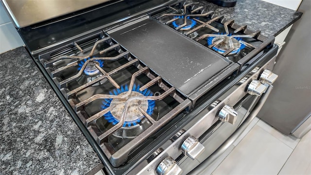 interior details with stainless steel gas range oven