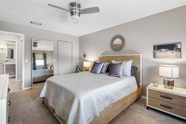 bedroom with a closet, visible vents, a ceiling fan, light carpet, and baseboards