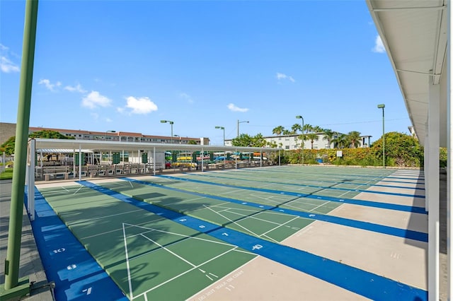 view of home's community featuring shuffleboard