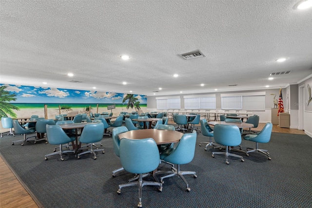 dining area with recessed lighting, visible vents, and a textured ceiling