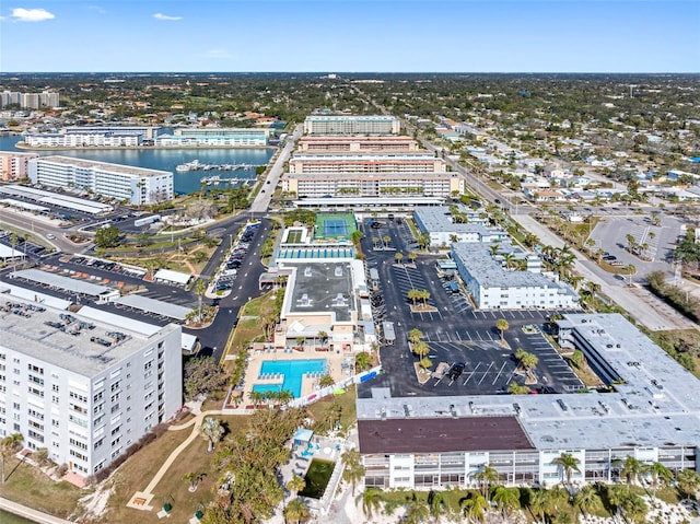 drone / aerial view featuring a view of city and a water view