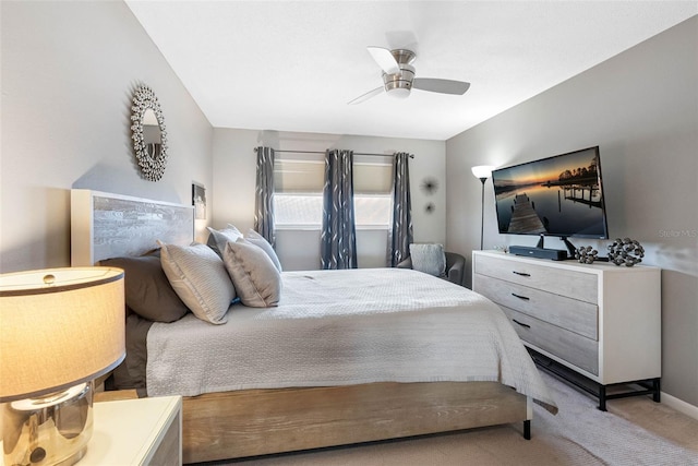 carpeted bedroom featuring ceiling fan and baseboards