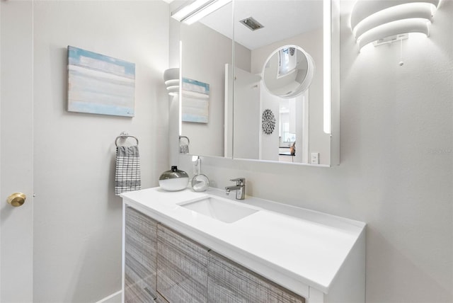 bathroom featuring visible vents and vanity