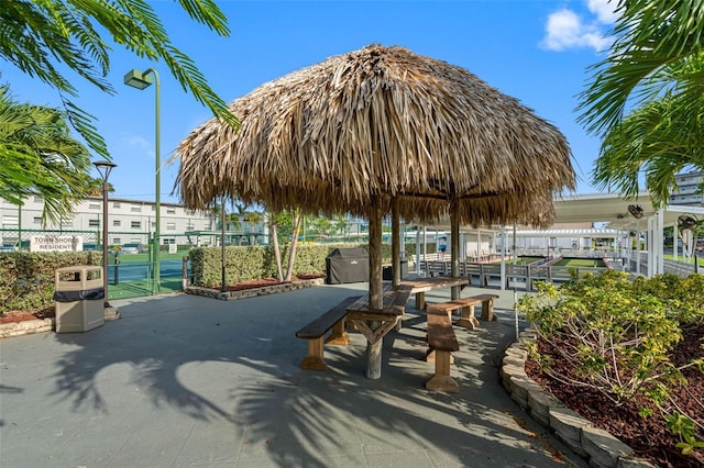 view of community with fence and a gate