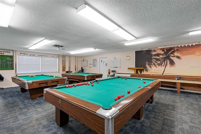 recreation room featuring billiards, a textured ceiling, and carpet flooring