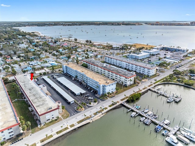 birds eye view of property with a water view