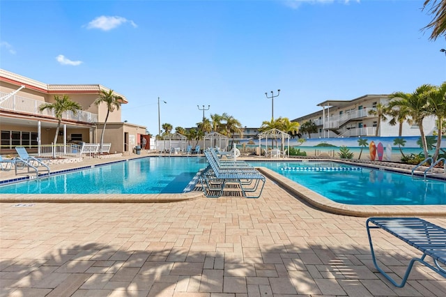 community pool with a patio