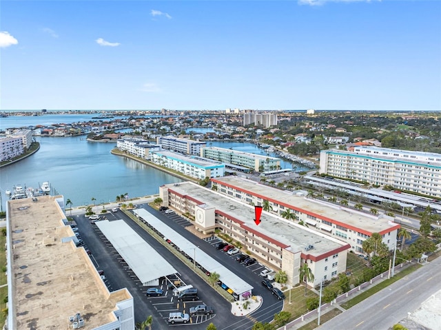 drone / aerial view with a view of city and a water view