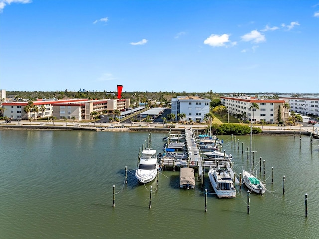 exterior space with a water view and a city view