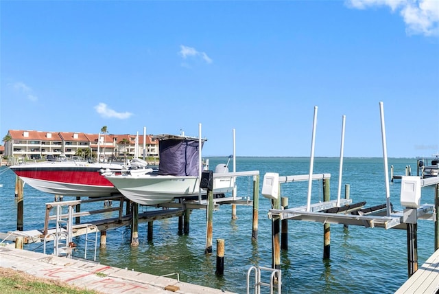 view of dock with a water view and boat lift