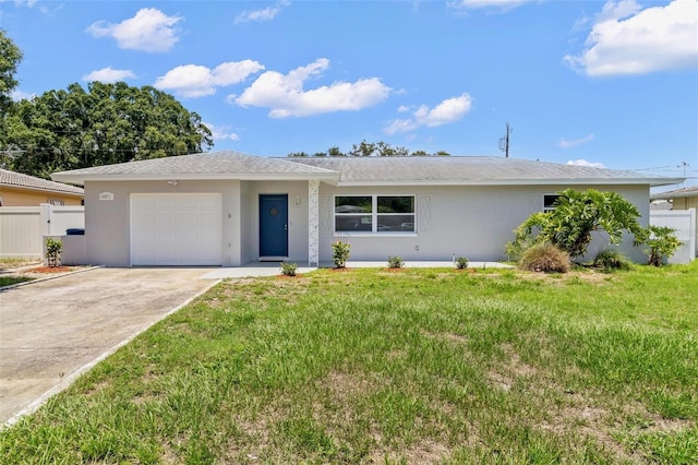 ranch-style home featuring a garage and a front yard