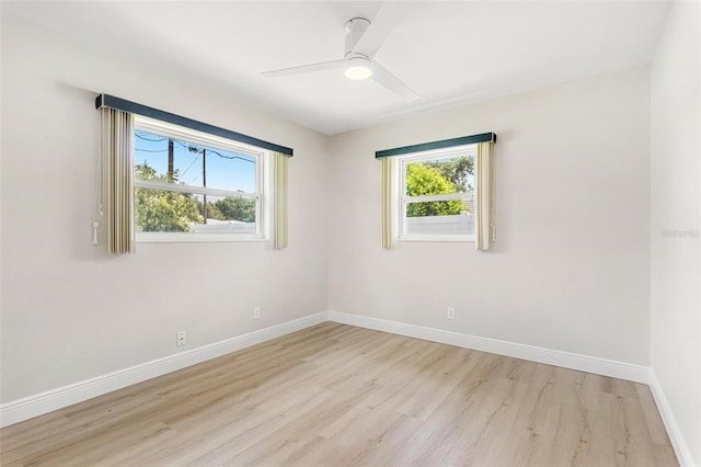 unfurnished room with light hardwood / wood-style flooring and ceiling fan