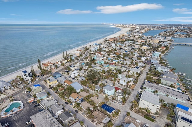 drone / aerial view with a water view and a view of the beach