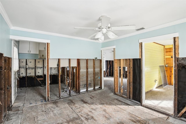 spare room featuring ornamental molding, visible vents, and a ceiling fan