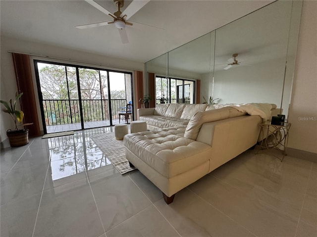 tiled living room featuring ceiling fan