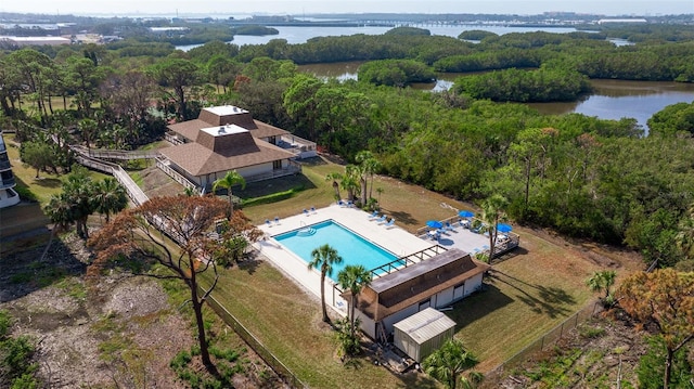 5400 Park St N Unit 209, Saint Petersburg, FL 33709 - aerial view of a pool, a nearby body of water, and a heavily wooded area