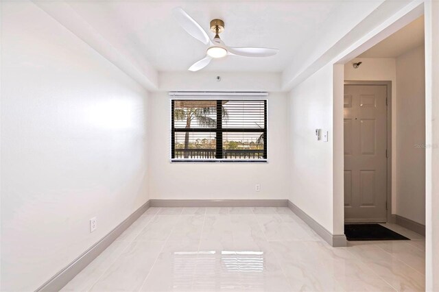 5400 Park St N Unit 209, Saint Petersburg, FL 33709 - spare room with ceiling fan and baseboards
