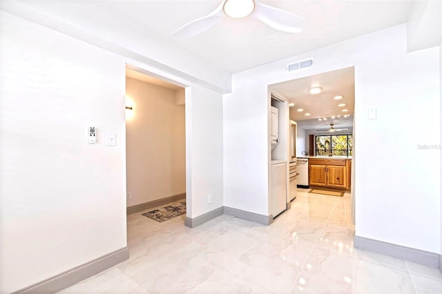 5400 Park St N Unit 209, Saint Petersburg, FL 33709 - spare room with a ceiling fan, baseboards, and light marble finish floors