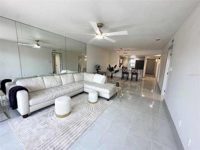5400 Park St N Unit 209, Saint Petersburg, FL 33709 - living room featuring a ceiling fan