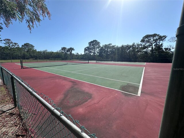 5400 Park St N Unit 209, Saint Petersburg, FL 33709 - view of tennis court with community basketball court