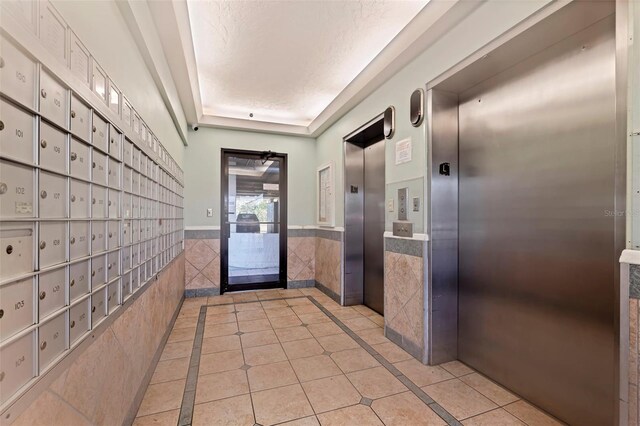5400 Park St N Unit 209, Saint Petersburg, FL 33709 - hall with elevator and mail area