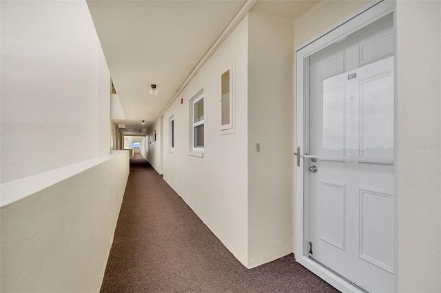 corridor with dark carpet