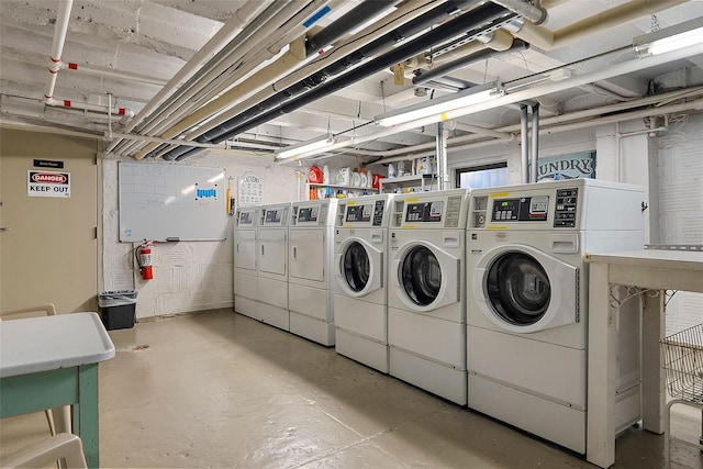 washroom with washing machine and dryer