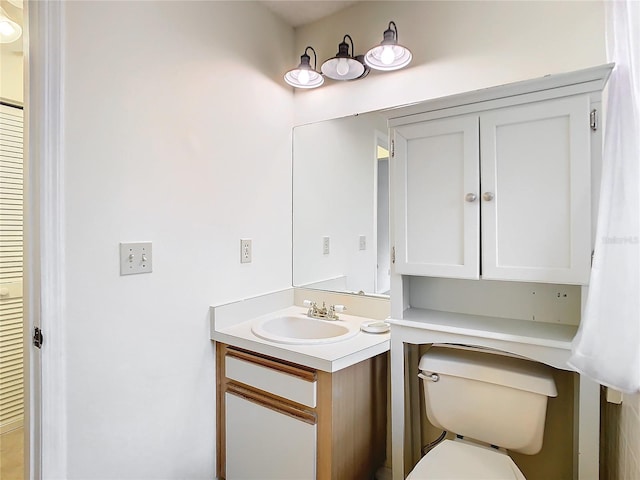 bathroom featuring vanity and toilet