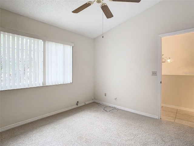 empty room with a textured ceiling and ceiling fan