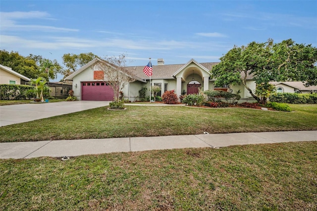 single story home featuring a garage and a front yard