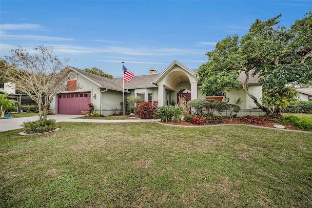 single story home featuring a garage and a front lawn