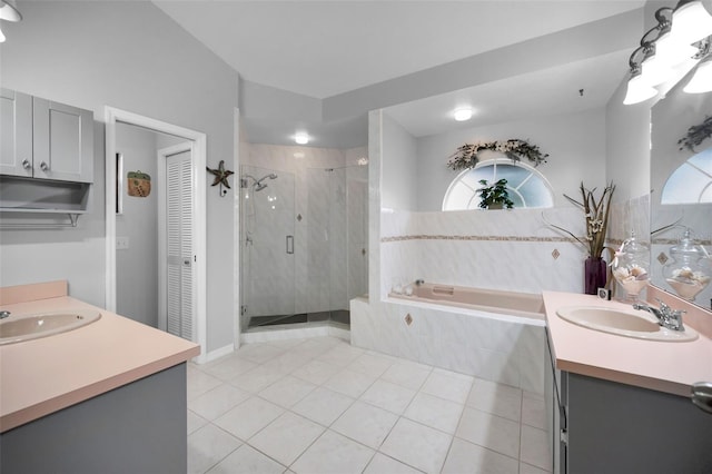 bathroom with vanity, tile patterned flooring, and separate shower and tub