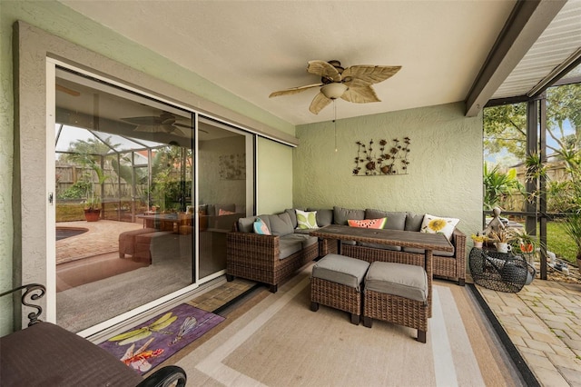 sunroom featuring ceiling fan