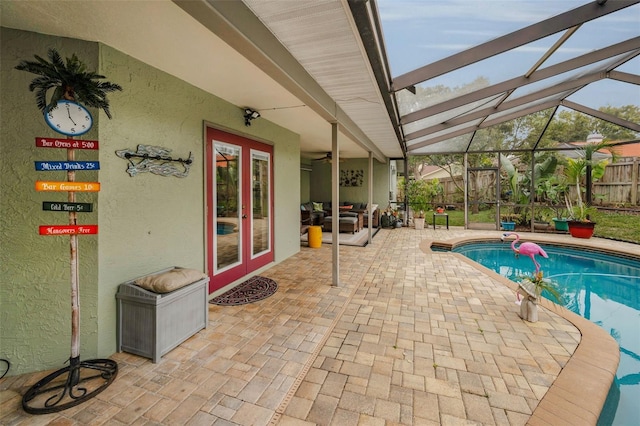 view of pool featuring a patio area, french doors, and glass enclosure