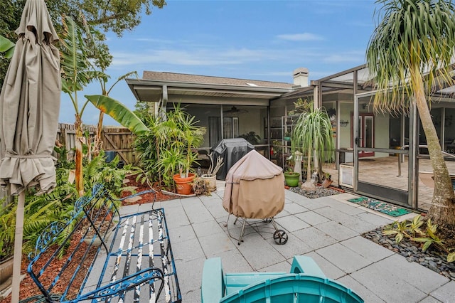 view of patio featuring a lanai